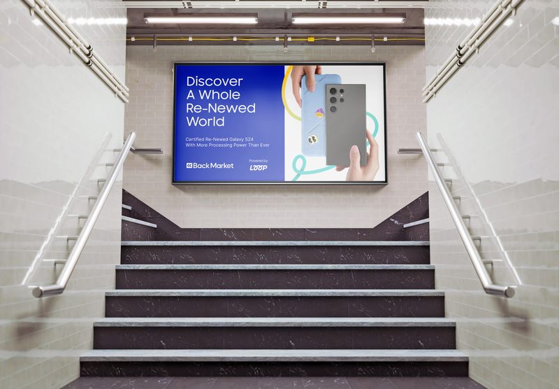 Co-branded screen above a station stairwell