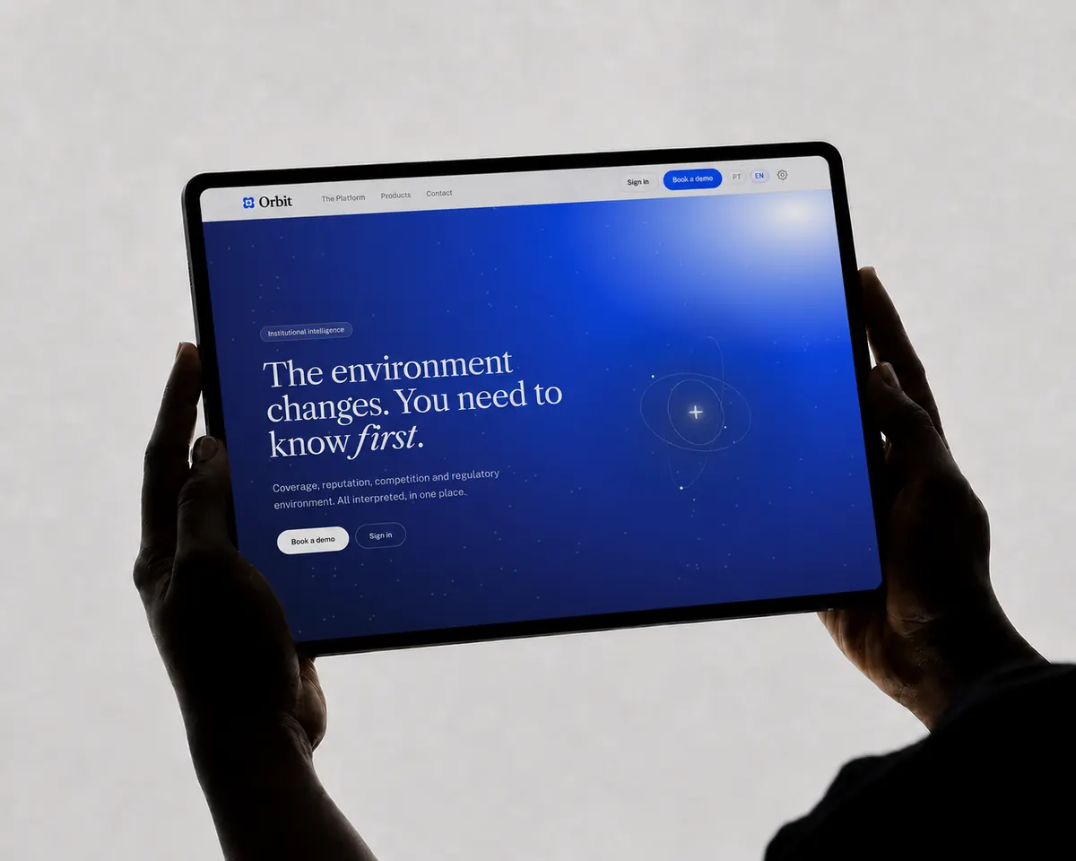Orbit landing page on a tablet held in two hands